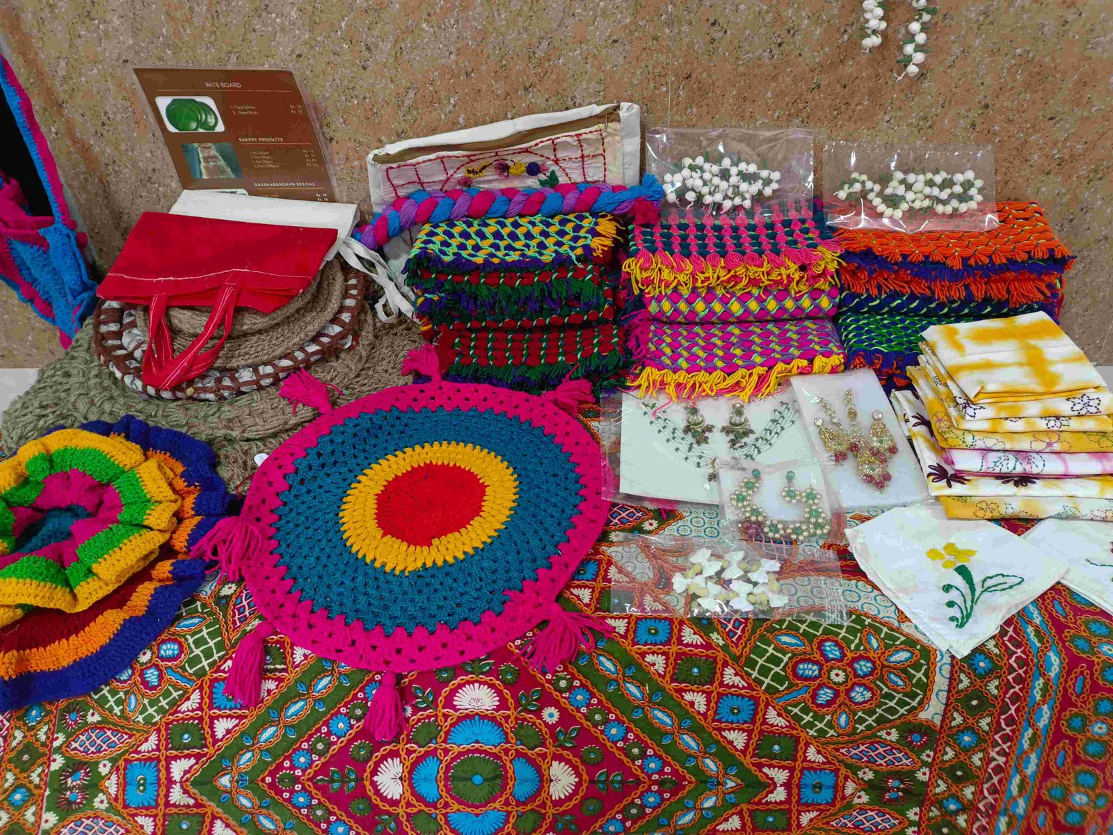 UDAAN home visits woman sitting in doorway rural village telehealth mental health care